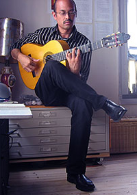 Flamenco guitarist Miguelito practicing at home
