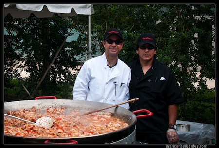 Casa Paella chefs standing proudly by their culinary creation